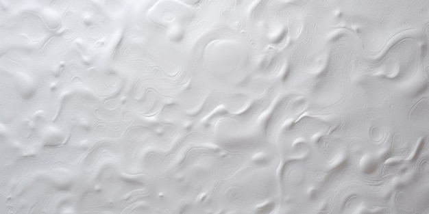 A white textured wall with a pattern of wavy lines and curves.