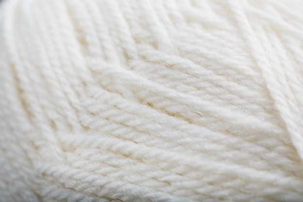 Photo white threads of natural wool close-up in full screen