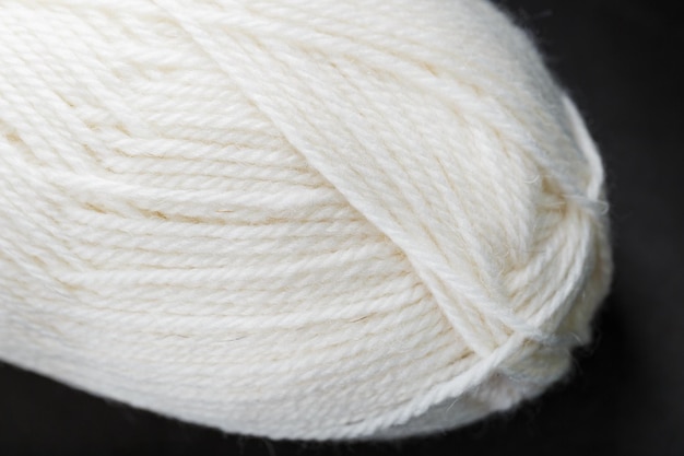 White threads of natural wool close-up in full screen