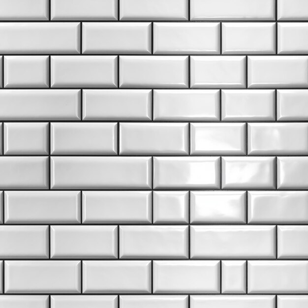 A white tile wall that is made of white tiles.