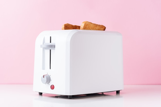 White toaster with roasted toast bread