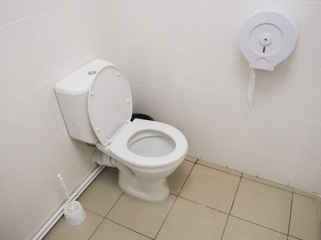 White toilet in the bathroom. Commercial bathroom.