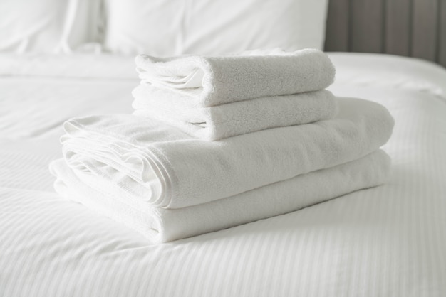 White towel on bed decoration in bedroom interior 