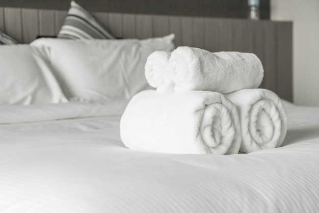 White towel on bed decoration in bedroom interior 