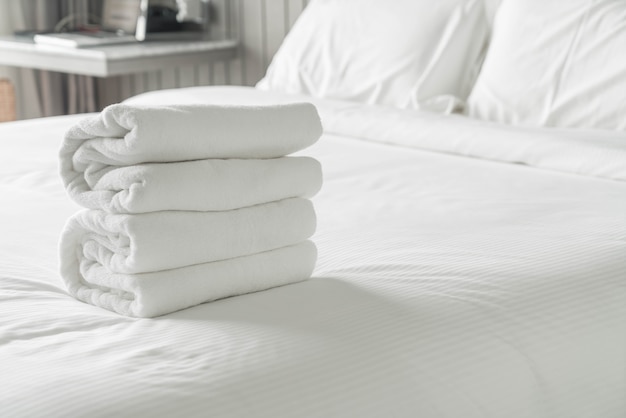 White towel on bed decoration in bedroom interior 