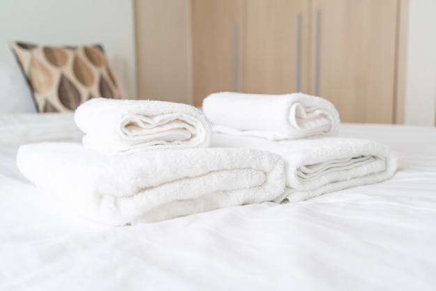 white towel decoration on bed