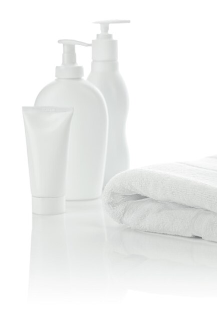 White towel with bottles and tube