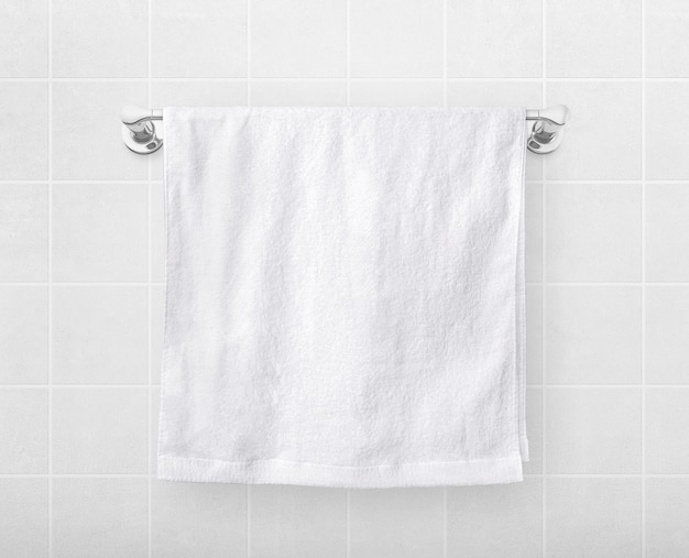 White towels hang on a hanger rod