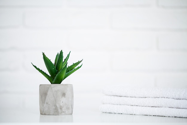 White towels on white table with copy space on bathroom