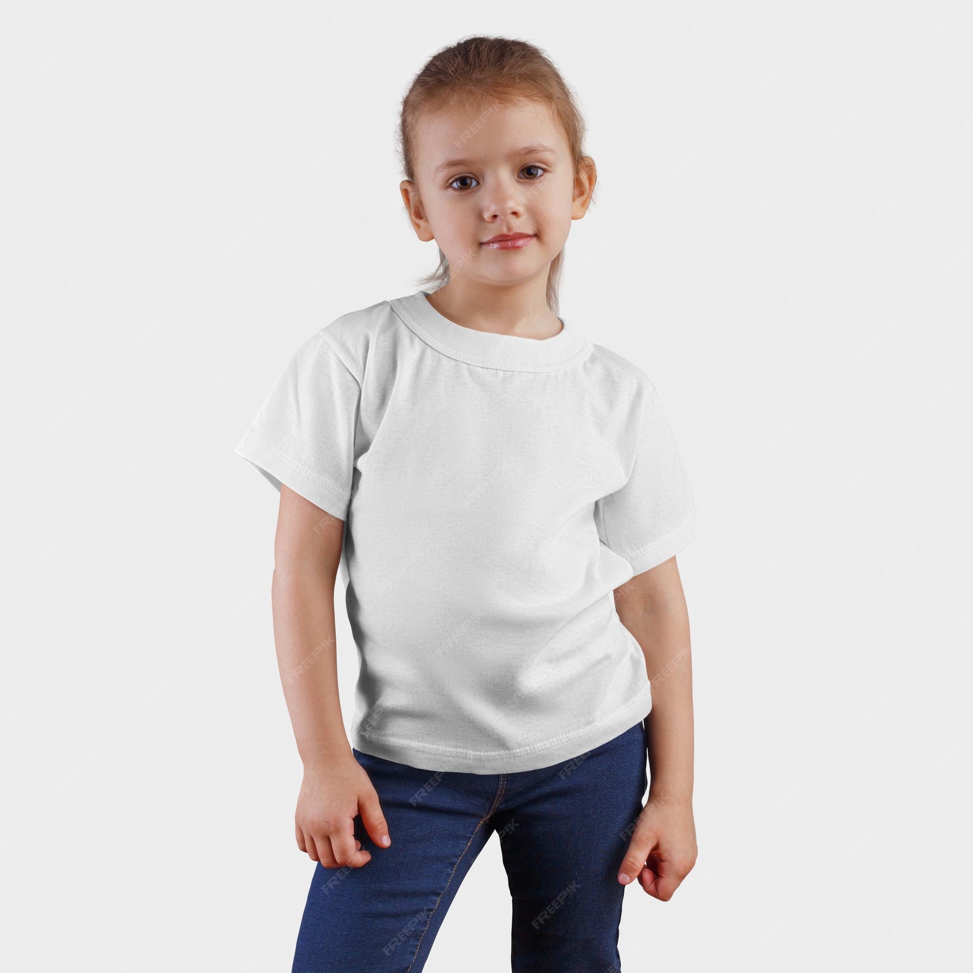 Premium Photo | White tshirt on a in blue jeans and a hand on the waist clothes on a child