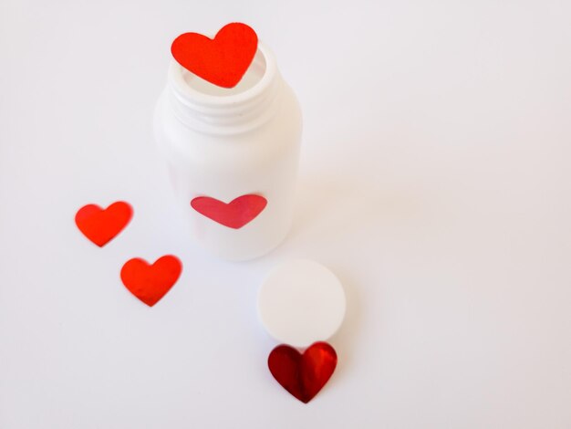 White tube jar with hearts copyspace love medicine medicine heart Valentines Day February 14