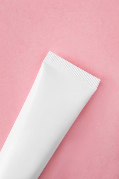 White tube on pink background