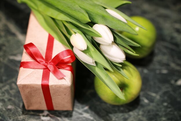 White tulip gift box green background