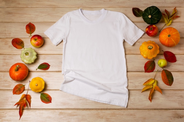 White unisex cotton Tshirt mockup with fall leaves apples yellow red and green pumpkins