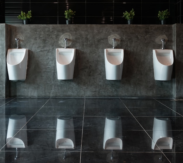 White urinals ceramic in men's bathroom