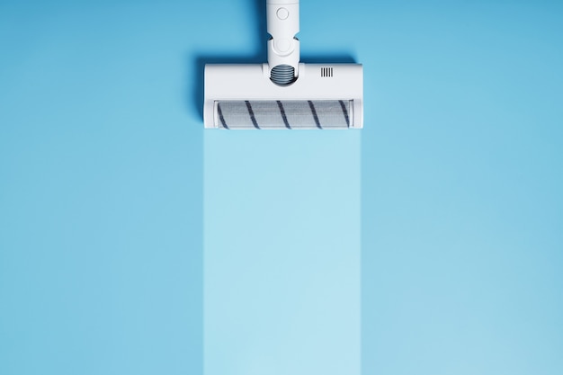 青い背景、上面図に白い掃除機のブラシ。すっきりとしたストライプで
