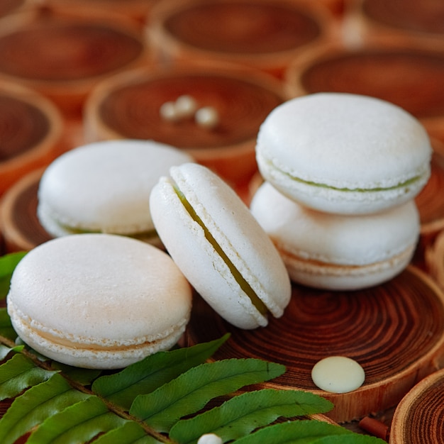 White vanilla macaroons on wooden