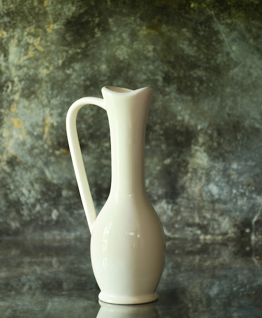 White vase on old glass desk for decorate in kitchen room