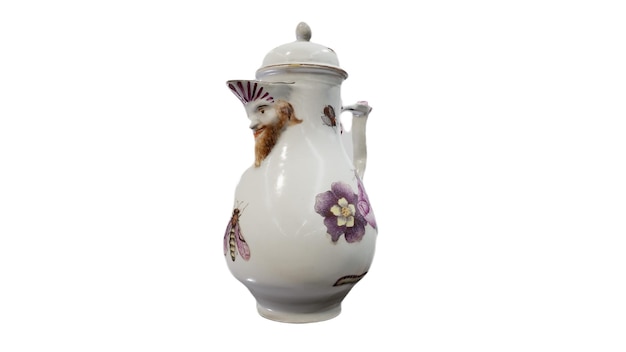A white vase with a floral design on the front of it