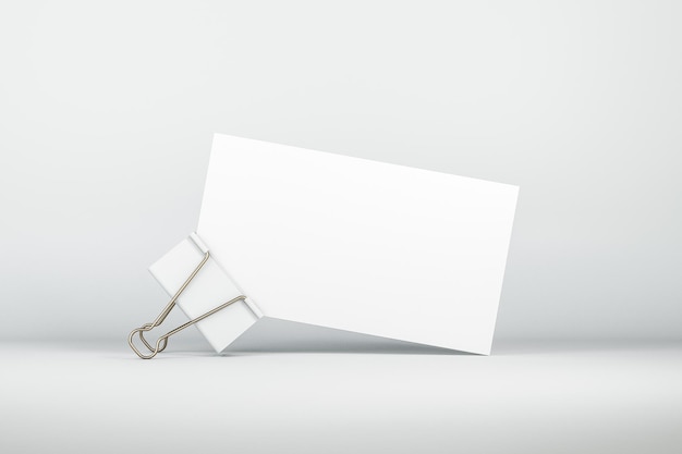 White visiting card stack with metal clip