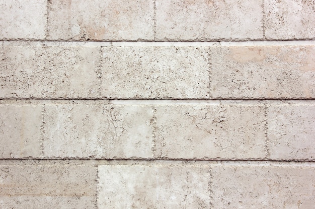 White wall made of big blocks of old. The texture of the stone. 