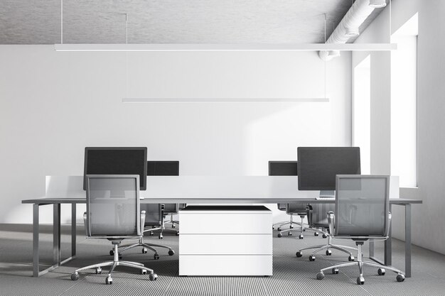 White wall office interior with loft windows, a gray carpet on the floor and rows of computer tables. 3d rendering mock up