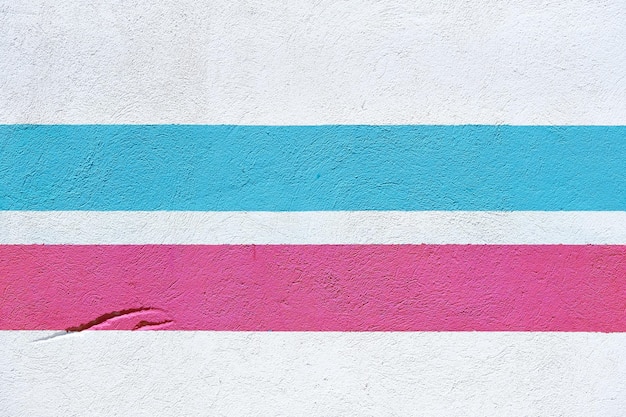 White wall with two colored stripes pink and blue