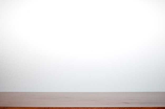 White wall and wooden table