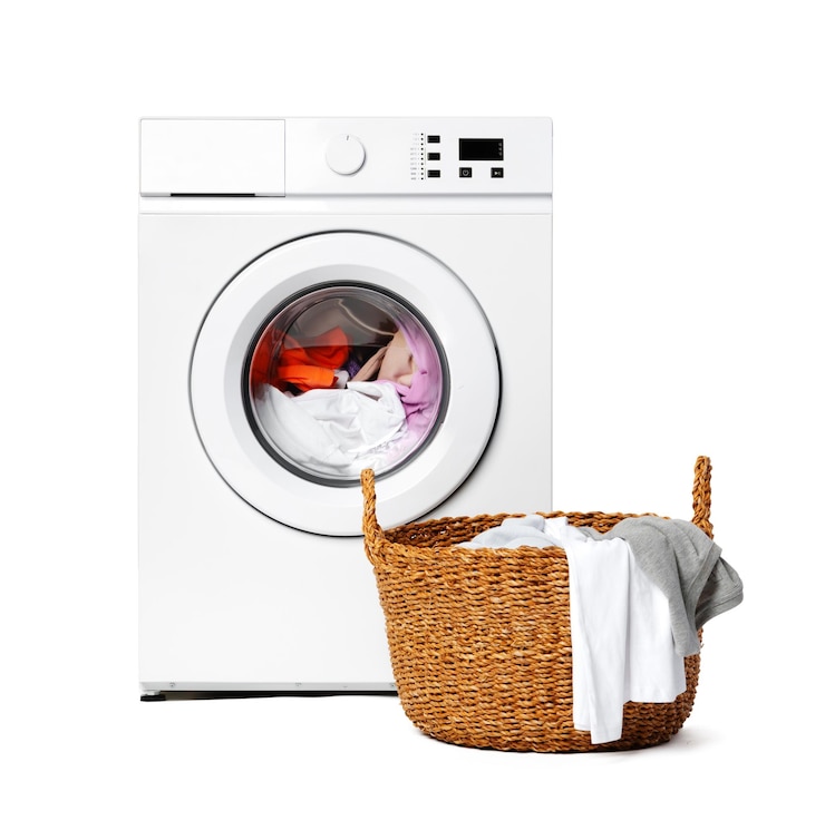 Photo white washing machine with laundry basket on top