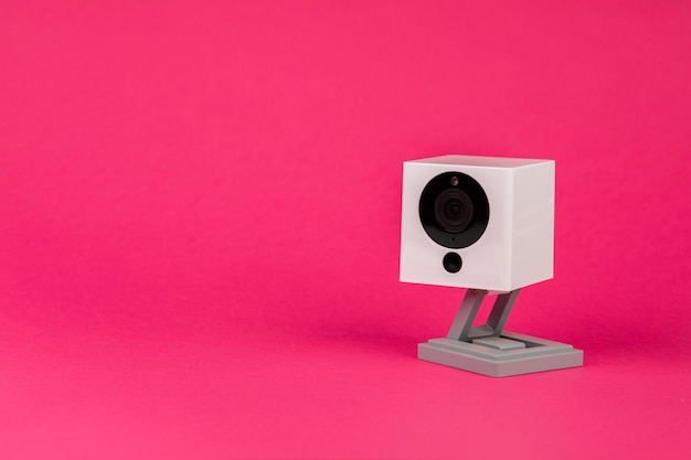 White webcam on red background object Internet technology concept