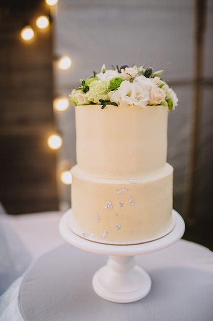 White wedding cake decorated with flowers