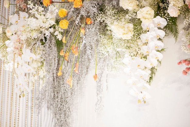 White wedding flowers on the wall