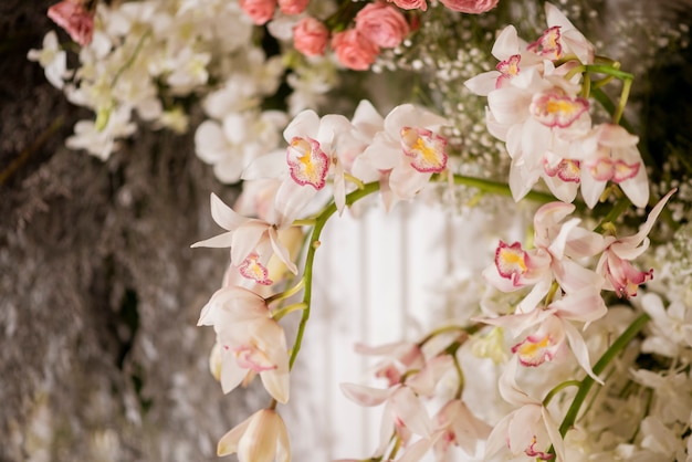 White wedding flowers on a wall