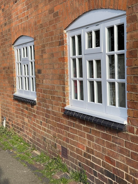 White windows in an old brick house