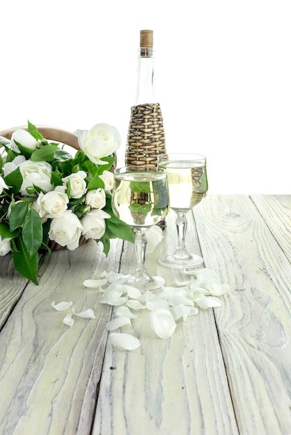 White wine and bouquet of roses