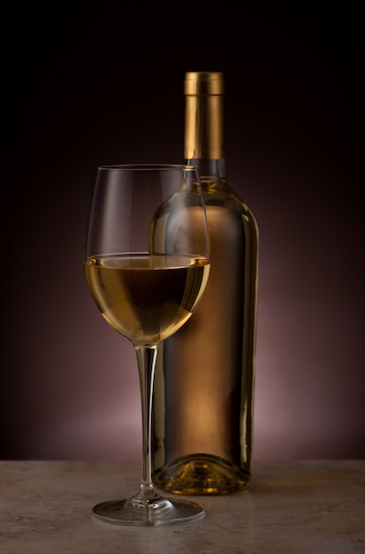 White wine glass and bottle