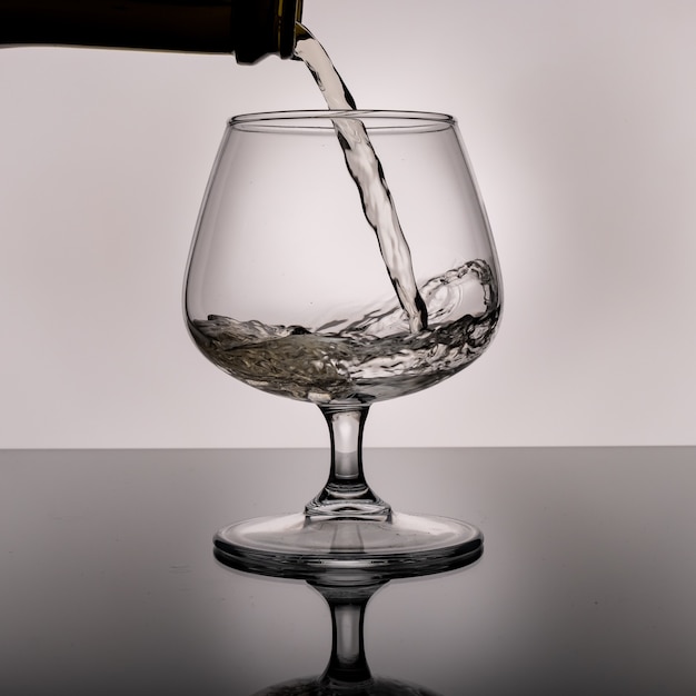 White wine is poured into a glass