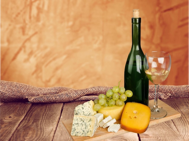 White wine with assorted cheese isolated on  background