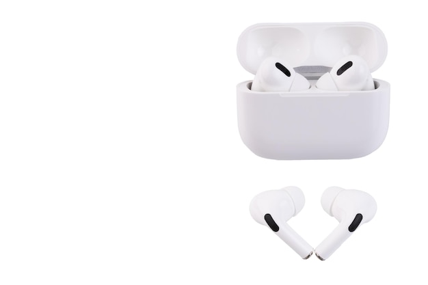 White wireless headphones in a storage and charging box