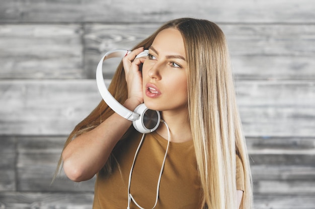 White woman with headphones