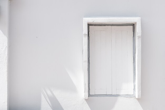 Photo white wood window on wall