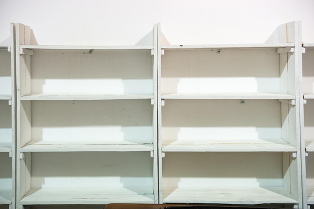 White wooden empty shelves