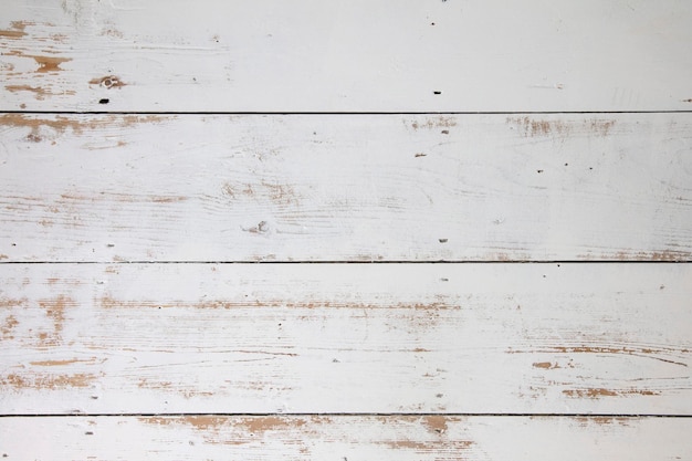 White wooden floorboards Distressed worn floorboard background painted white