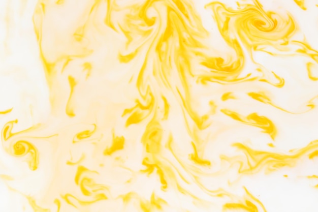 Photo white yellow abstract background yellow pattern of paints on liquid fluid art