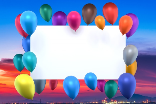 whiteboard with multicolored balloons on sunset sky