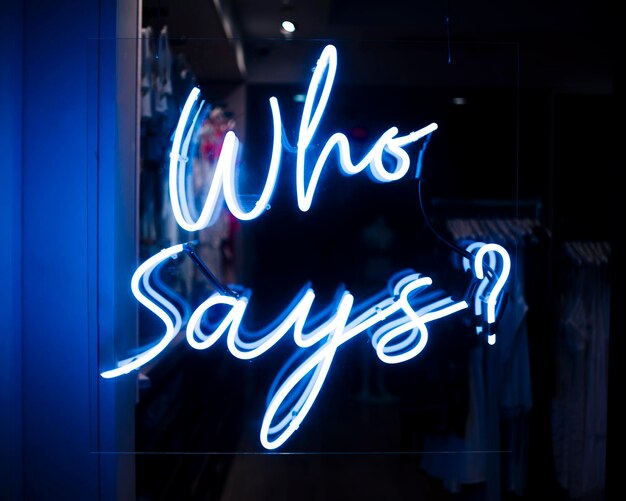 Photo who says quote sign neon lights