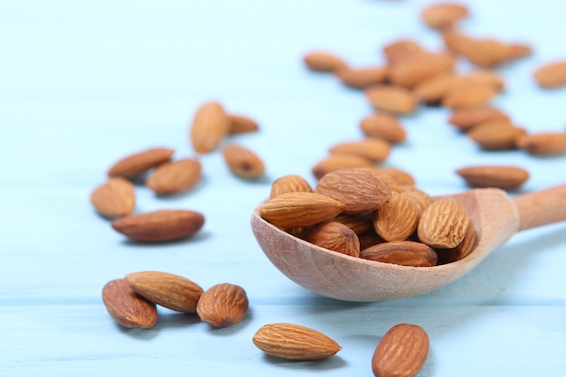 Whole almonds on the table on a light background closeup