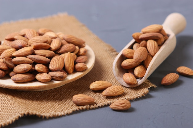 Whole almonds on the table on a light background closeup