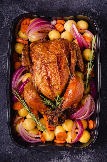 Whole baked chicken with vegetables