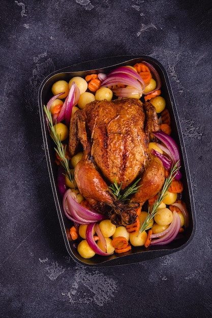 Whole baked chicken with vegetables